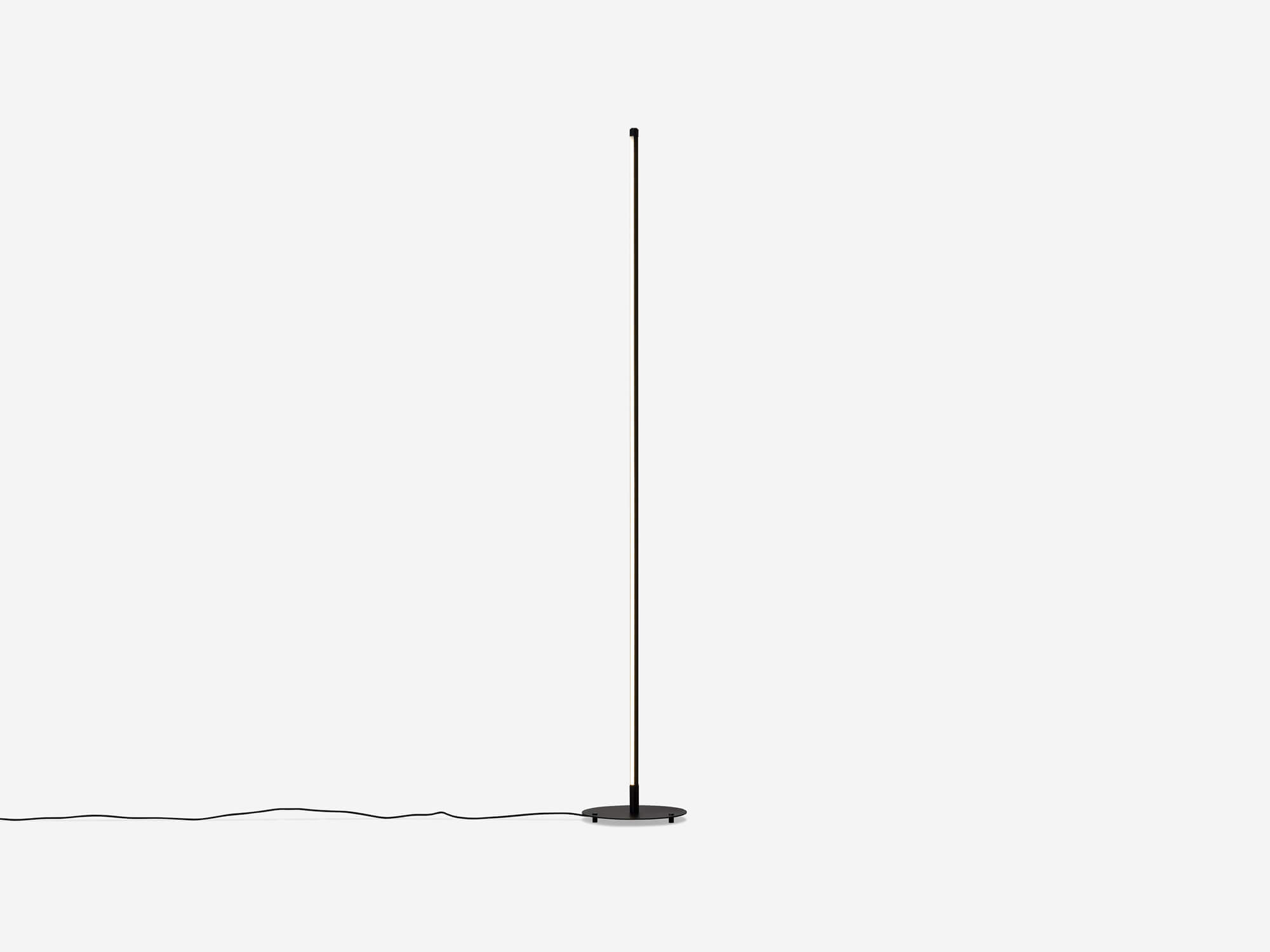 Side view of slim black floor lamp